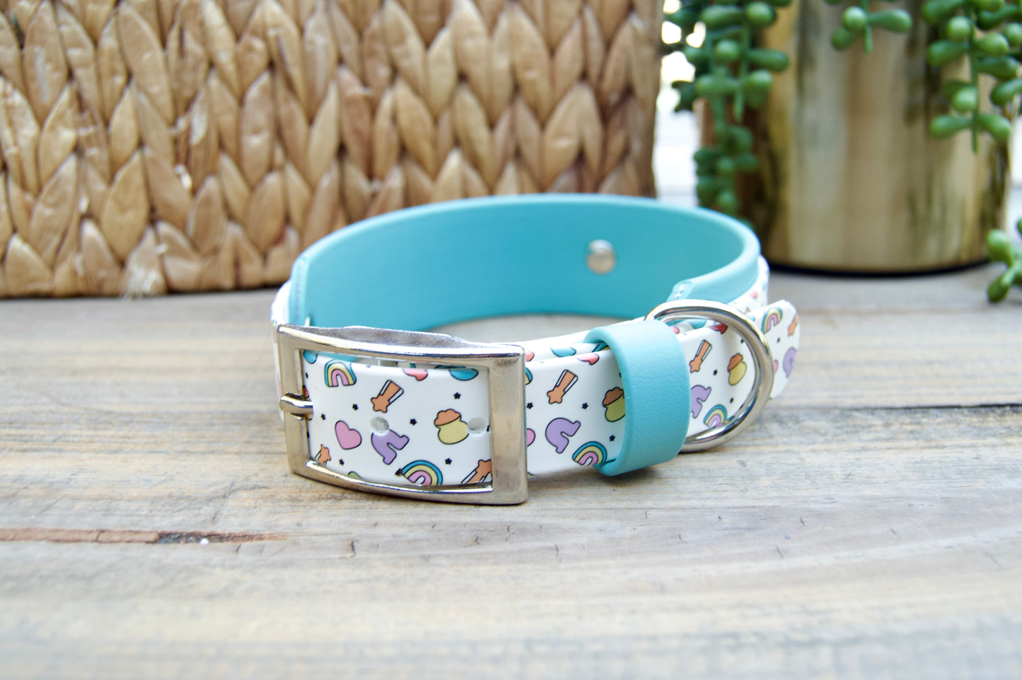 Dog collar with Lucky Charm pattern with Dusty Turquoise Accents on a wooden surface