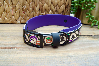 Halloween cookies patterned dog collar with purple band on a wooden surface