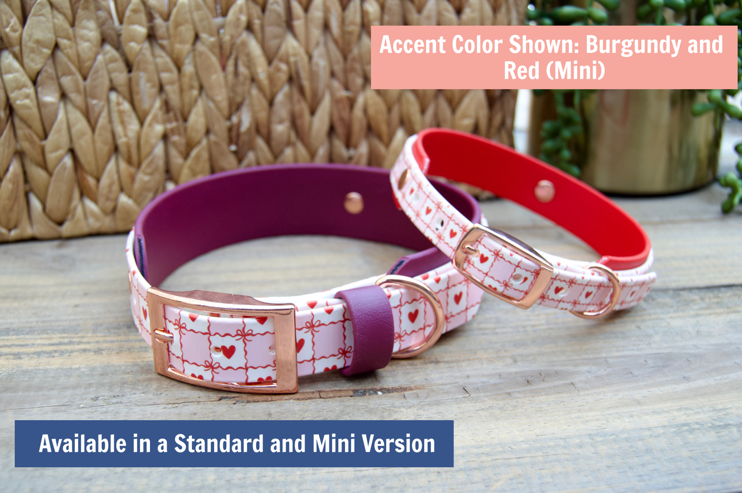 Two Biothane dog collars with heart patterns on a wooden surface, one burgundy and one red.