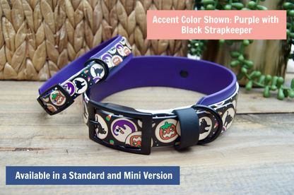 Mini and standard Dog collars with halloween cookies design stacked on a wooden surface.