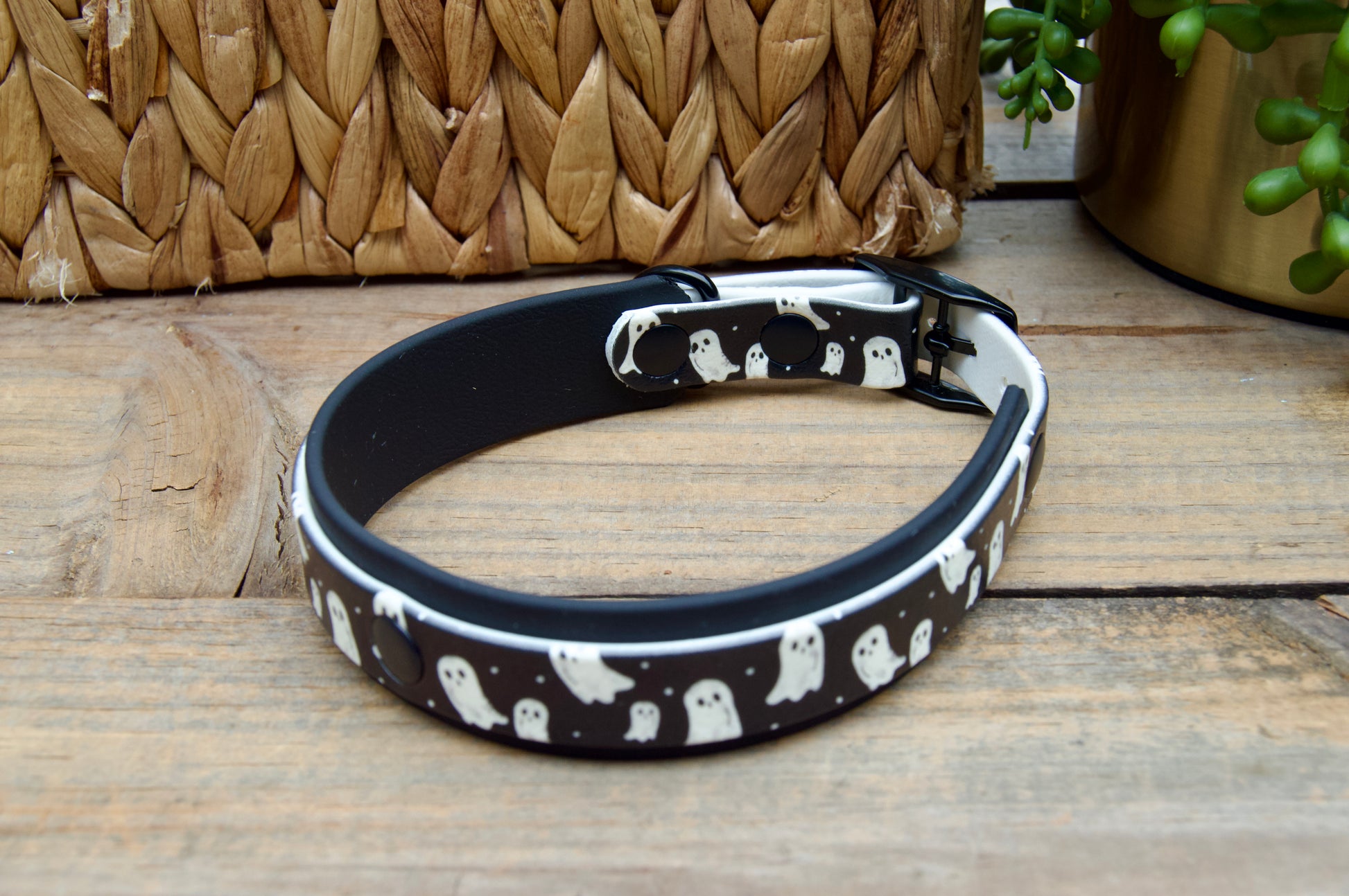 Dog collar with ghost pattern on a wooden surface