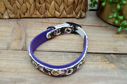 Dog collar with halloween cookies design on a wooden surface