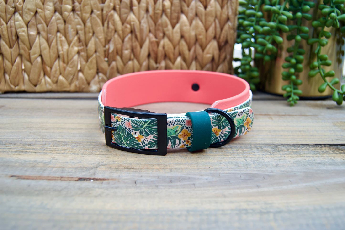 biothane Dog collar with tropical floral pattern on a wooden surface